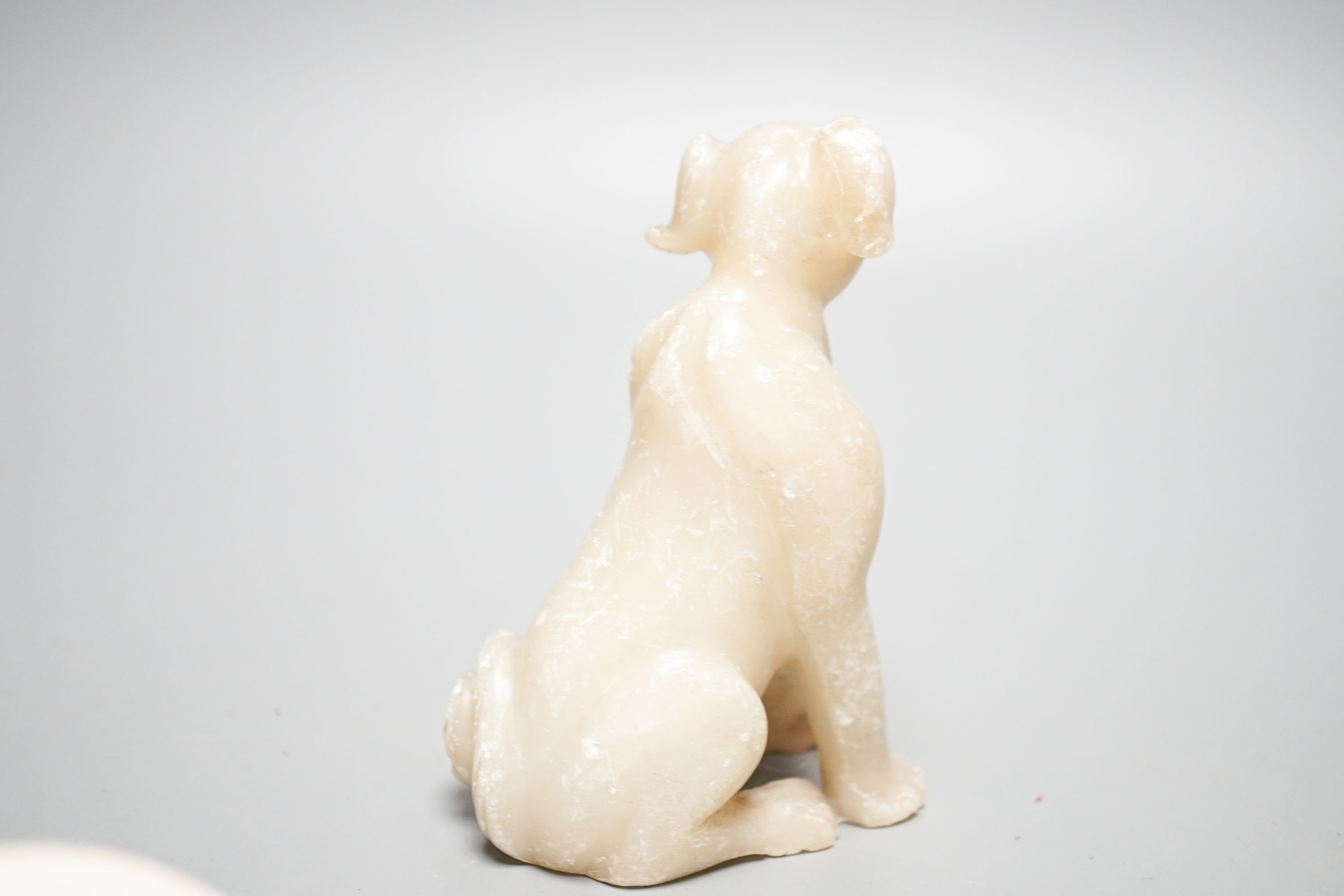 Two Chinese Qingbai bowls, probably Song Dynasty, largest 13, cm and a Chinese soapstone figure of a seated dog, 10.5cm (3)